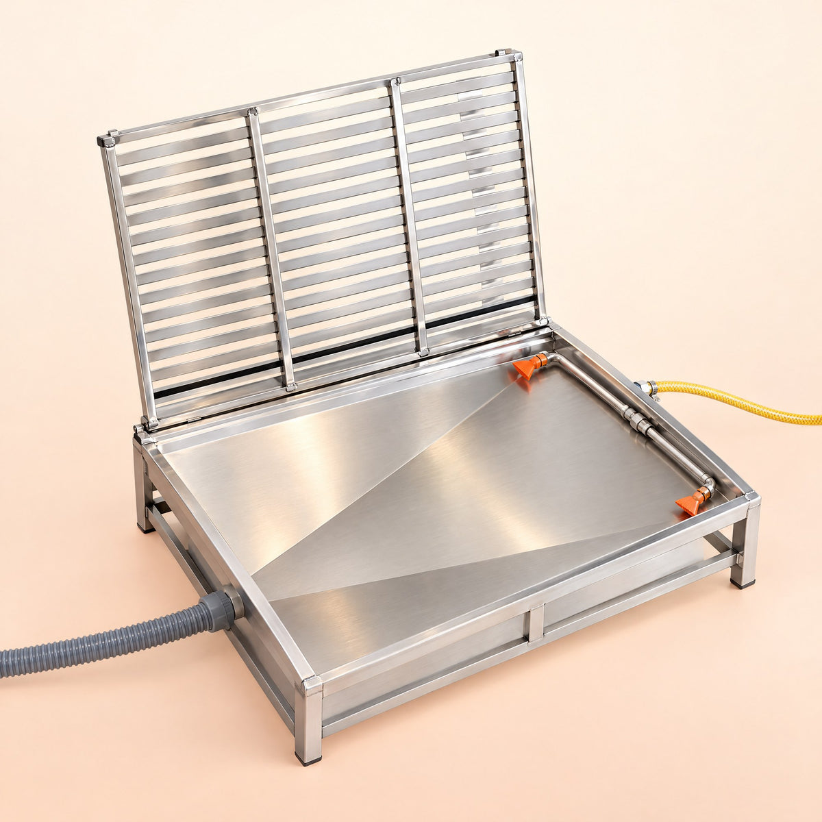 Kiba Rinse with the slatted top lifted, showing the sloped pan and two spray nozzles
