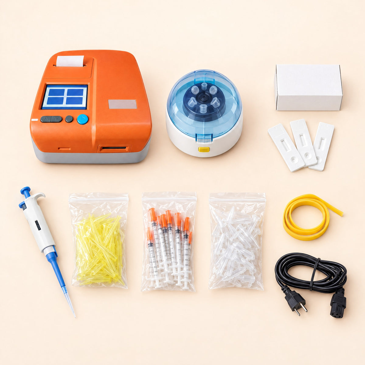 Everything in the Kiba Peak kit laid out: reader, mini centrifuge, test cards, pipette and tips, syringes, tubes and tourniquet
