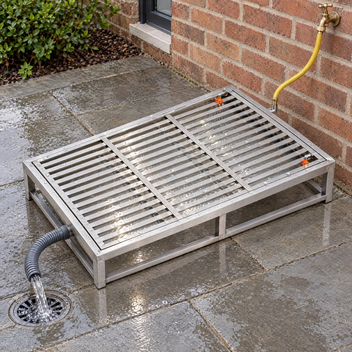 Kiba Rinse on a patio with the rinse running under the slats