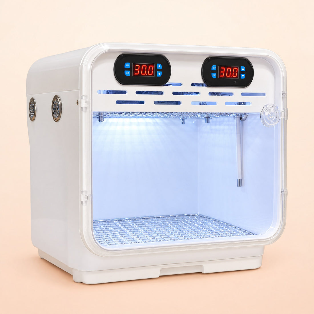 Kiba Fledge warm-air bird brooder, front three-quarter view with the interior light on