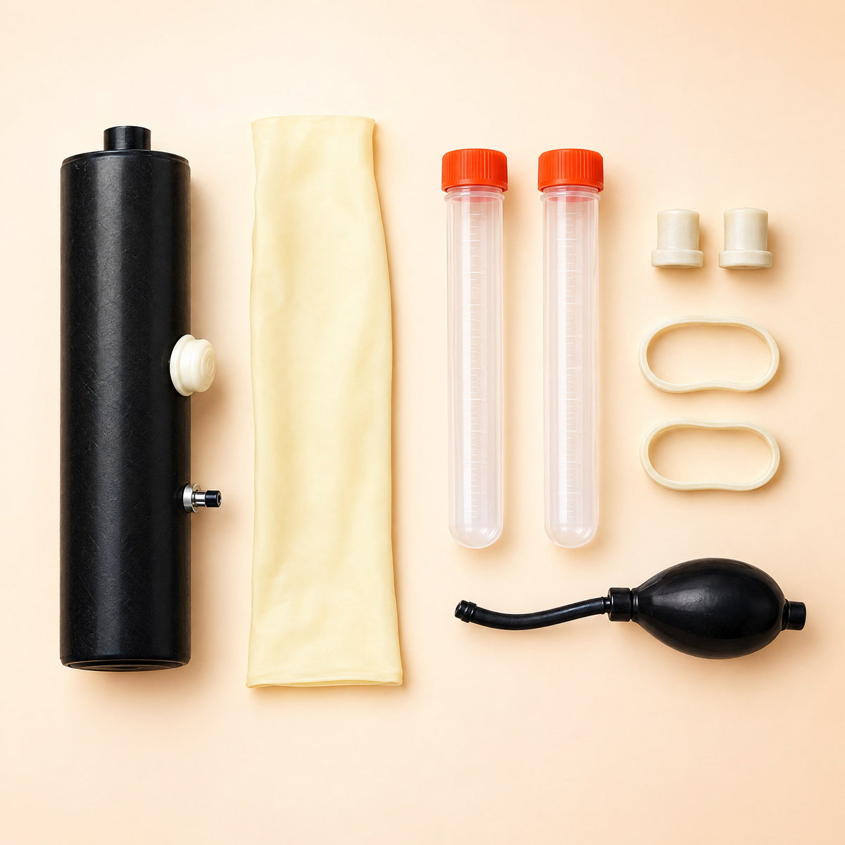 Every part of the Kiba Collect Goat kit laid out: body, liner, two collection tubes, two stoppers, two rubber bands and the squeeze bulb