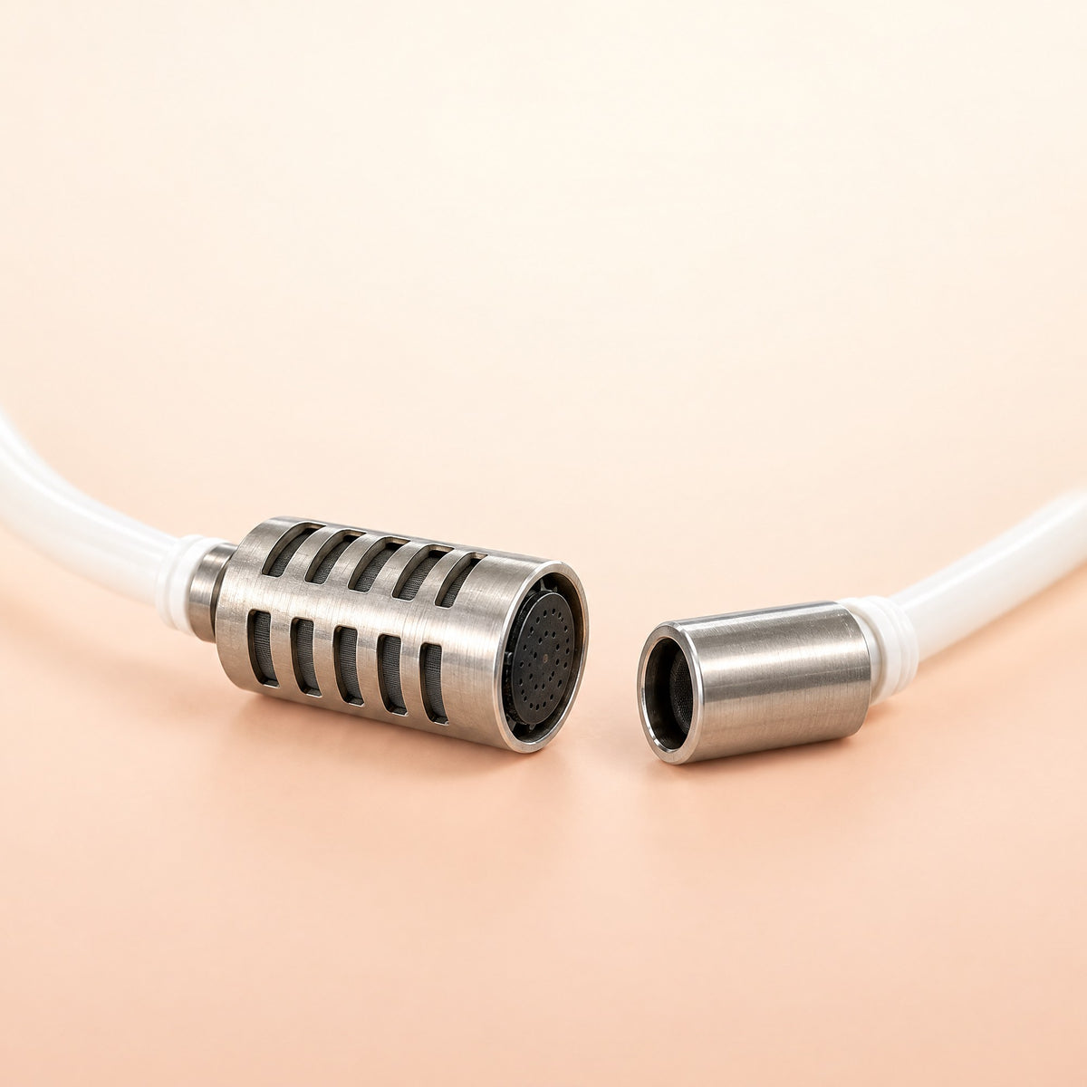 Stainless steel aerator head and strainer on white hoses