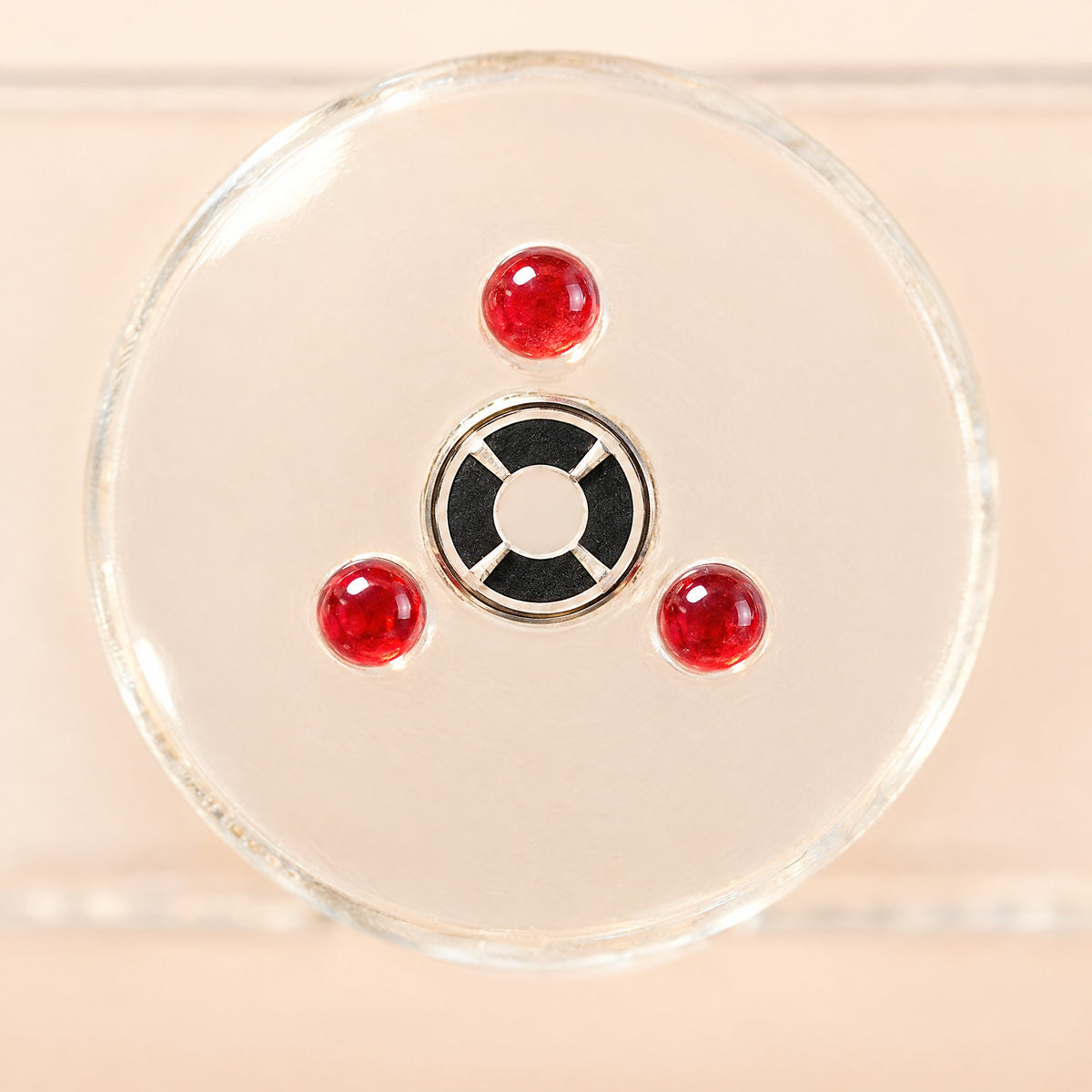 Close-up of the three ruby spacers around the counting area of Kiba Count